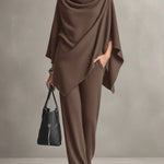 Two-piece set featuring a high-neck cape-style top and wide-leg trousers.