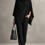 Two-piece set featuring a high-neck cape-style top and wide-leg trousers.
