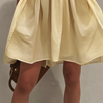 Yellow Sleeveless Mini Dress with Deep V-Neck and Lace Trim