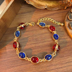 Gold Tone Alternating Red Blue Cabochon Alloy Bracelet