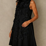 Black Sleeveless Mini Dress Featuring Striking Floral And Bow Details