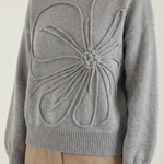 Knitted sweater with floral design